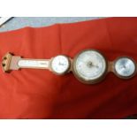 A Salem mahogany finish barometer, with clock, temperature and realtive humidity dials, 67 cm approx