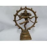 An Indian bronze of Shiva Nataraja, modelled dancing within a ring of fire, ona a stepped
