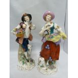A pair of Continental porcelain figures of a shepherd and shepherdess, with Chelsea gold anchor faux