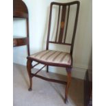 A Scottish Art Nouveau mahogany bedroom chair, with stylised tulip design back splat, h 100 cm