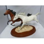 Racing the Wind - a porcelain figure group of two horses, designed by Pamela du Boulay, marked