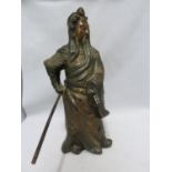 A large cast metal figure of a Samurai, gilt and copper highlights, 33cm high approx