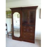 An Edwardian mahogany compactum wardrobe, breaks down in to component pieces, w 151 x h 215 x d 57