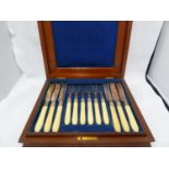 A cased close plated and bone fruit service, for 12, the bone handles reeded, in mahogany fitted