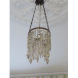 A pair of ceiling centerpiece lustre lights composed of various finger lustres on a central brass