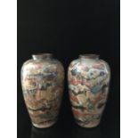 An unusual pair of decalcomania type glass baluster vases, internally decorated to resemble striated