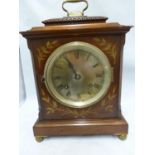 A J W Benson mantel clock, the arched top case containing a silvered dial, the case with marquetry