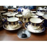 A group of English porcelain teawares including two part tea sets decorated with fruiting vines or