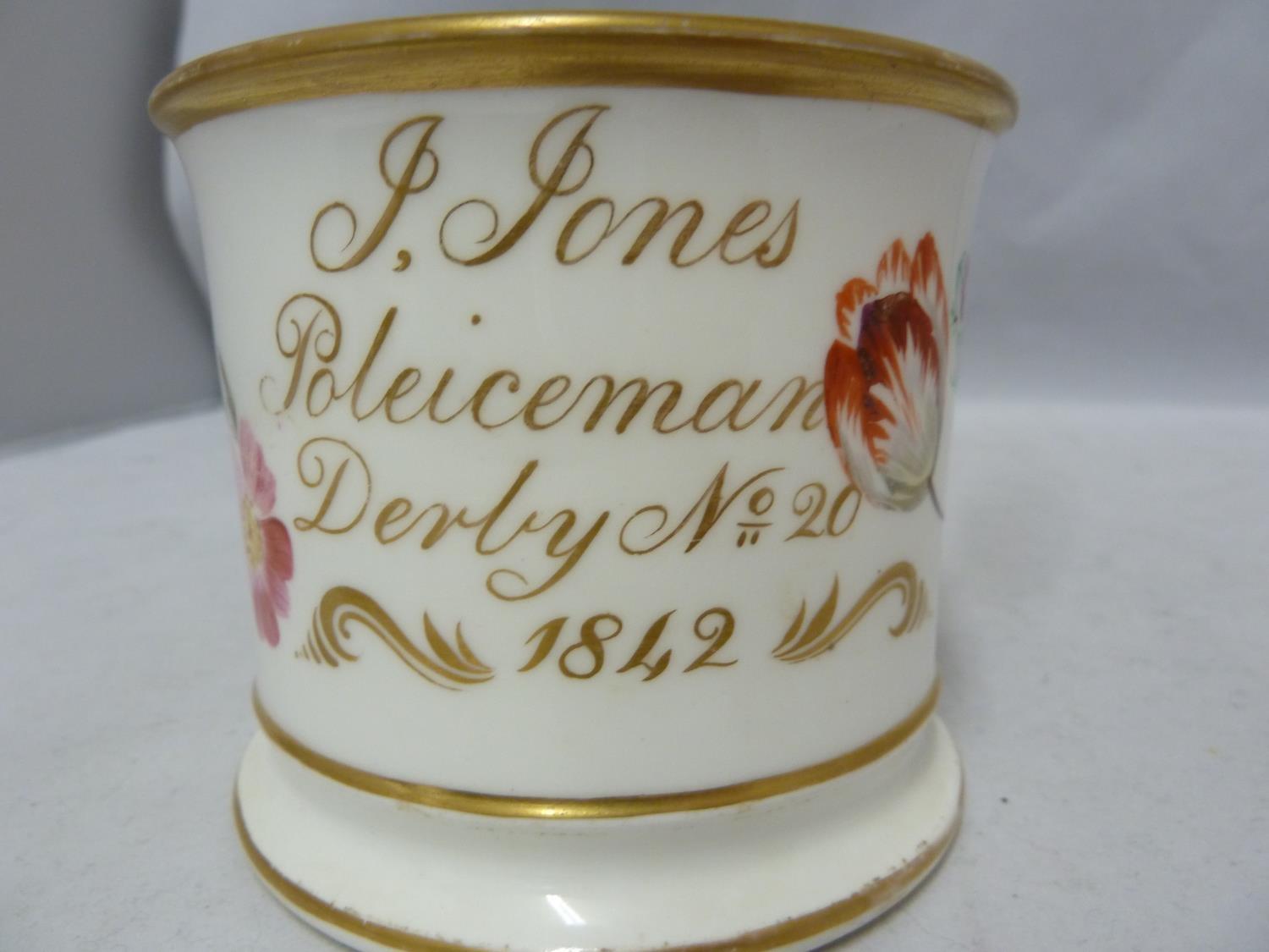 Police Interest / Derby Family History - A porcelain mug decorated with polychrome painted flower