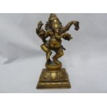 An Indian bronze figure of Ganesh as an elephant god, modelled standing on a lotus flower on stepped