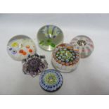 Paperweights - five millifiore decorated weights; and one enclosing a flower (6)