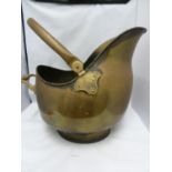 A brass finish helmet form coal scuttle, 40cm high approx