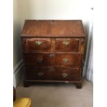 WITHDRAWN - SOLD - A Queen Anne walnut veneer bureau, the fall front over 2 short and two long
