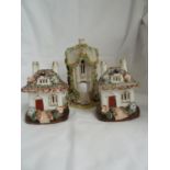 Three Staffordshire pottery pastille burners, two of the same shape, cottage size with double