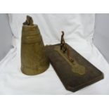 An oak and brass wall bracket and bell, the bell of conical form, bell 40 cm including suspension