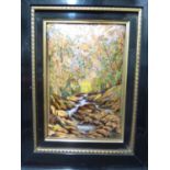A Limoges enamel plaque, decorated with a autumnal wooded stream, framed, 48 x 38.5cm max