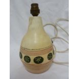 A vintage Atomic pattern pottery lamp base, decorated with sputnik and stylised plant forms on green