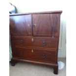 A mahogany pot cupboard, of two bowed cupboard doors over two long drawers and on bracket feet, h 70
