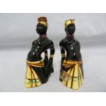 A pair of Italian pottery 'Jamaica' shape Drioli cherry brandy bottles, the semi-clad females