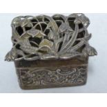 A silver pomander box and cover, rectangular, the cover pierced with with bluebell type flowers,