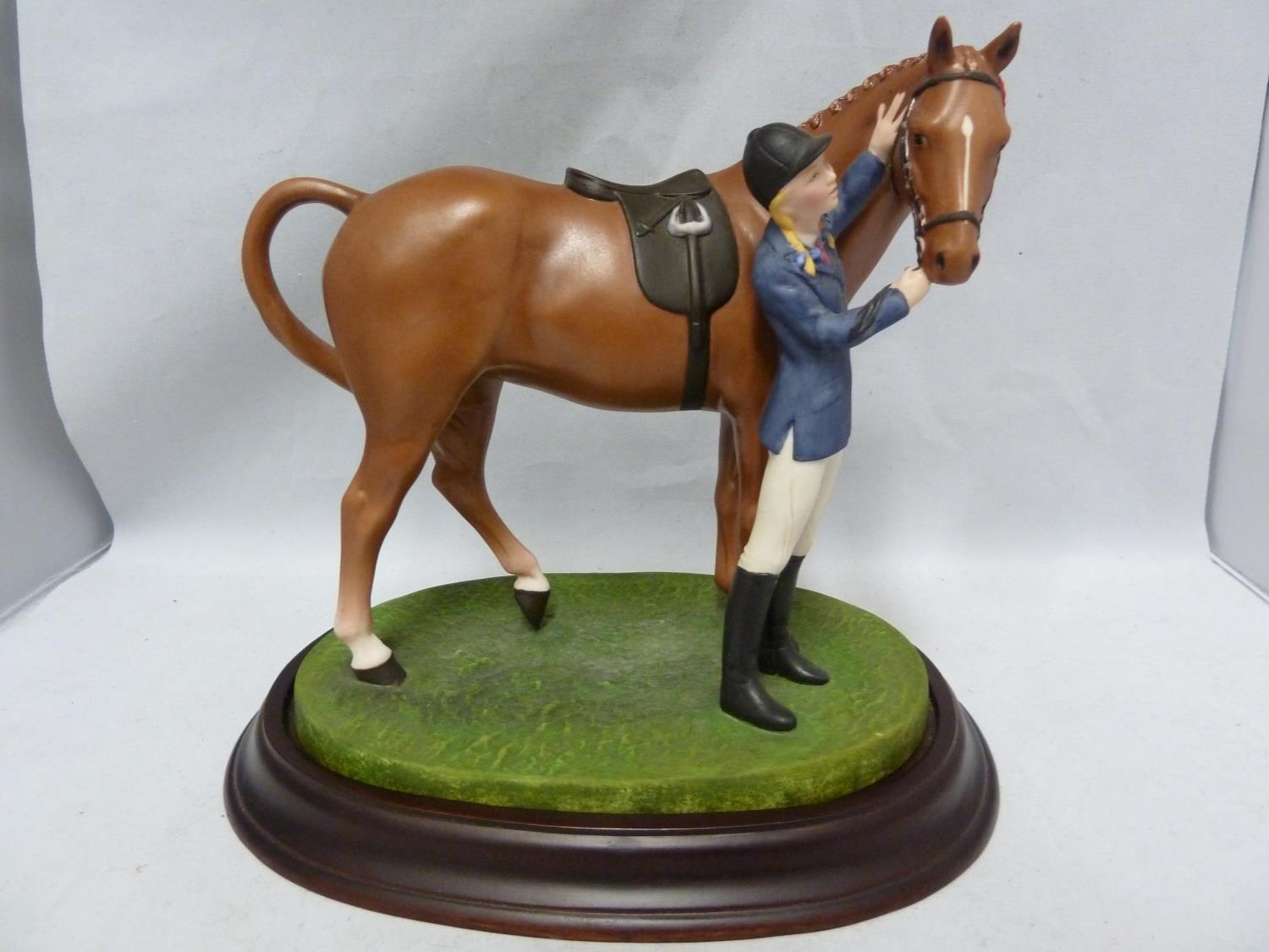 The British Horse Society - First Prize, a porcelain figure group of a girl with a pony, designed by