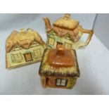Cottage Ware - three pottery items formed as English Country Cottages, comprises: teapot and