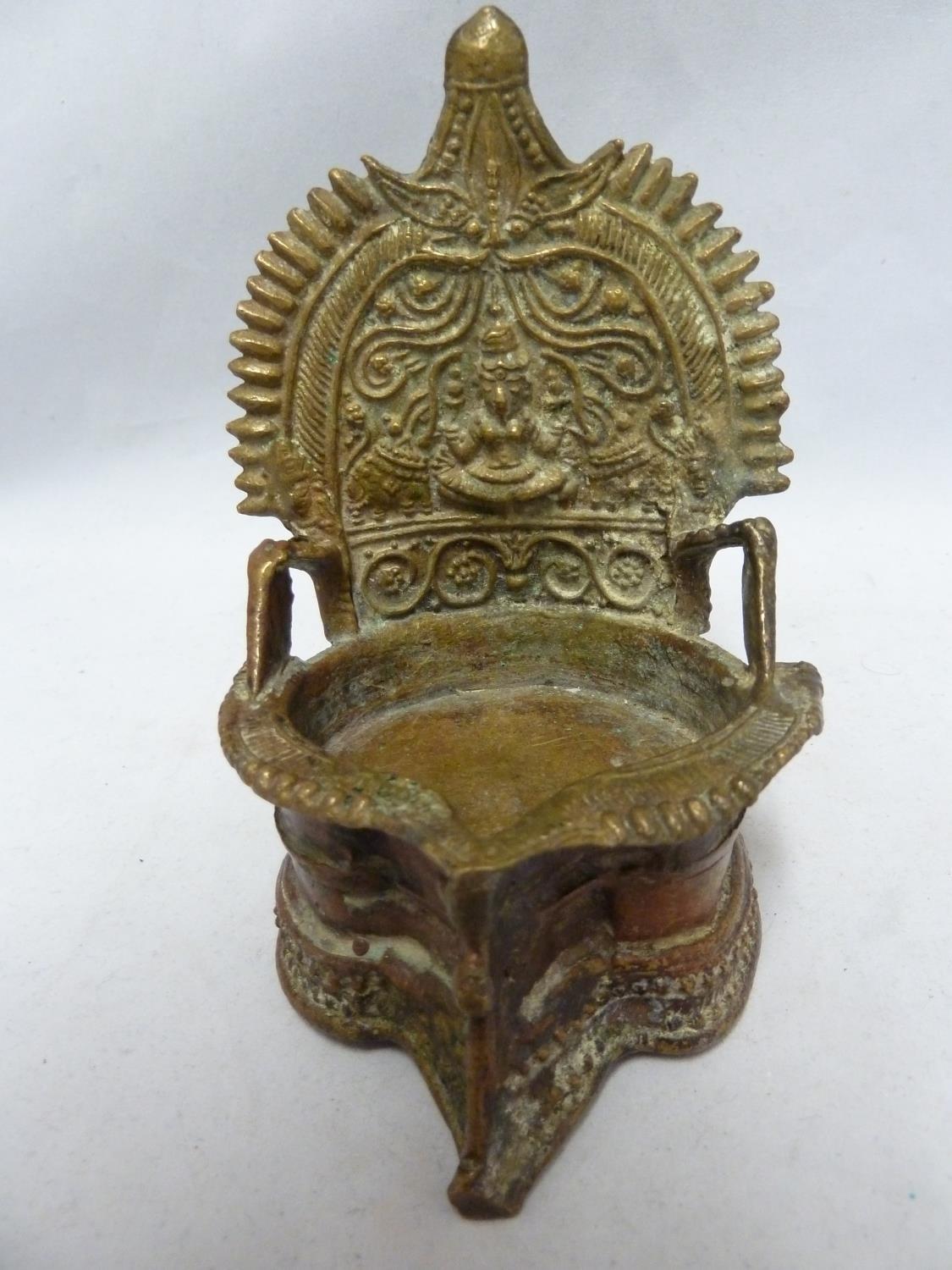 An indian temple votive stand formed as a high backed pool with central bhudda motif, 14cm high