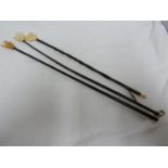 Three bone and turned wood back scratchers, each formed as a hand, 40cm and smaller (3)