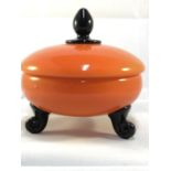 Michael Powolny for Loetz - an orange glass powder bowl and cover, circular on three black rams horn