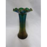 Kralik - An iridescent green glass vase, in Loetz style, of flared cylindrical form with wavy rim,