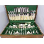 An oak canteen containing silver plated old English pattern cutlery (qty)