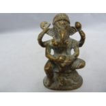 An Indian miniature brass temple figure of Ganesh, on oval base, a salamander at Ganesh's feet, 7.