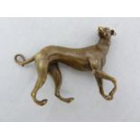 A small bronze figure of a grey hound, naturalistically modelled probably after the Antique, 8cm max