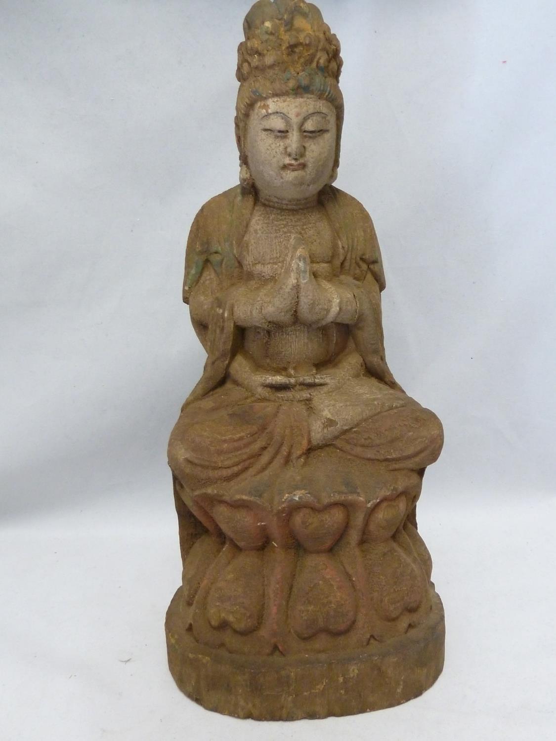 A carved wood figure of Bhudda, with traces of coloured decoration, 39cm high approx