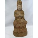 A carved wood figure of Bhudda, with traces of coloured decoration, 39cm high approx
