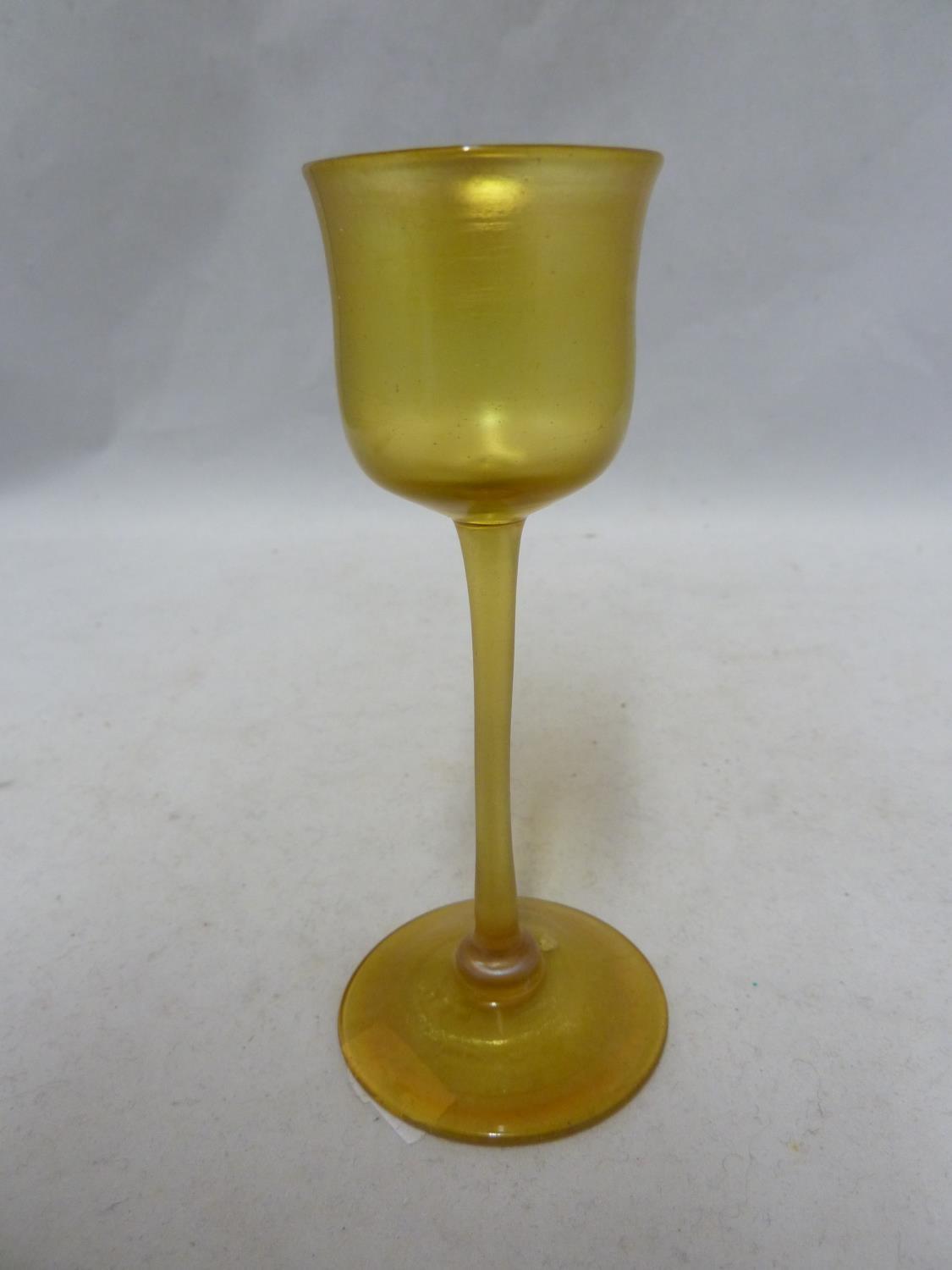 Tiffany, American - a Favrile iridescent amber liqueur glass, LCT mark to pontil, 11.5cm high