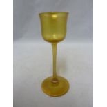 Tiffany, American - a Favrile iridescent amber liqueur glass, LCT mark to pontil, 11.5cm high