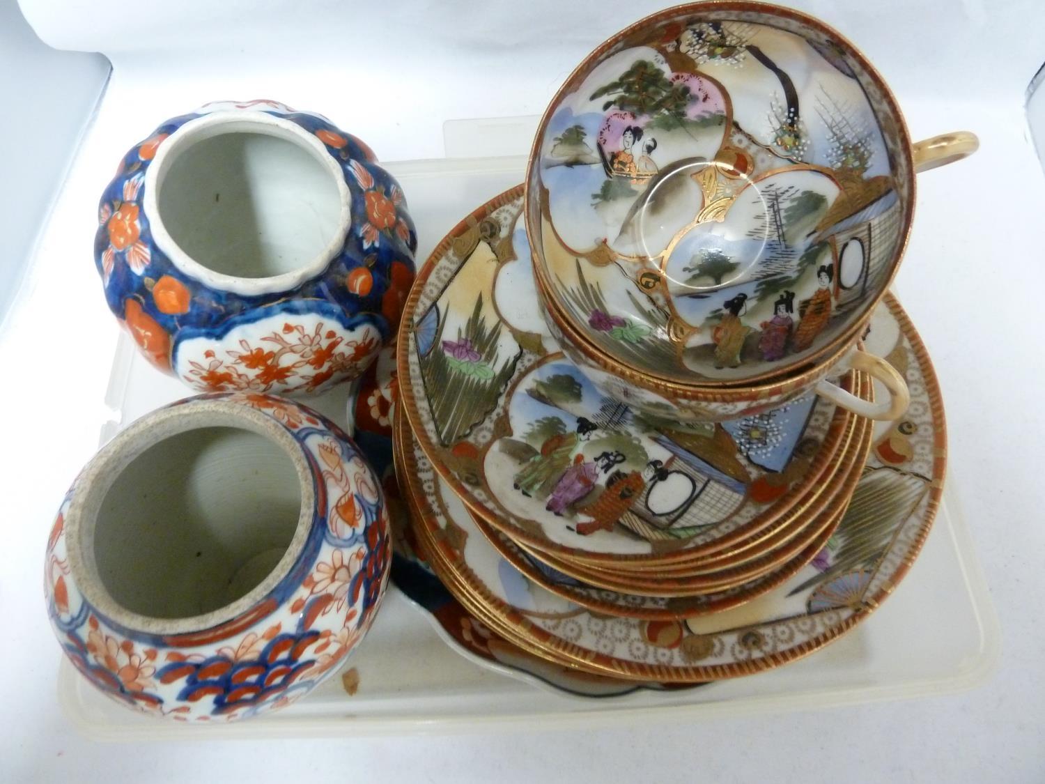 Japanese Imari porcelain - comprises a plate; and two vases, typically decorated in iron red and