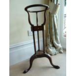 WITHDRAWN - A mahogany tripod jardiniere stand, 76 cm high