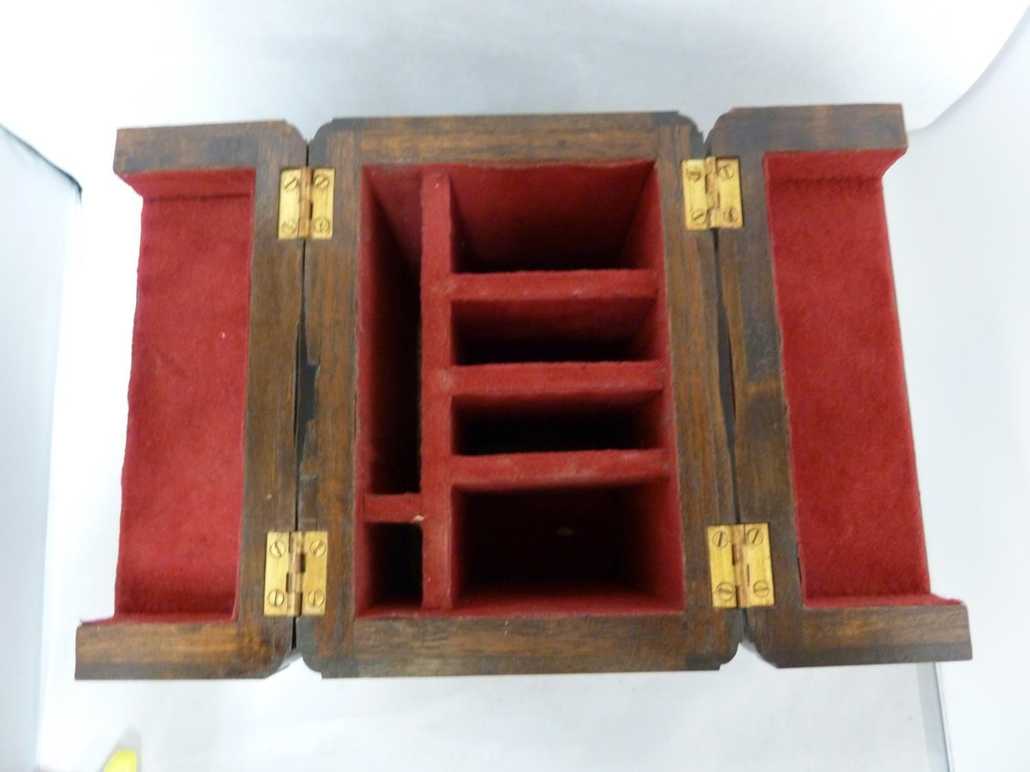 A mahogany knife box, rectangular with mirror shaped panels and domed folding top, 27cm high