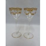 A pair of Continental glass wine glasses, probably Josephinehutt, the bowls decorated in two