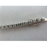 A Cubic Zirconia set tennis bracelet, in white metal marked 925, small size, 18.5 cm diam closed