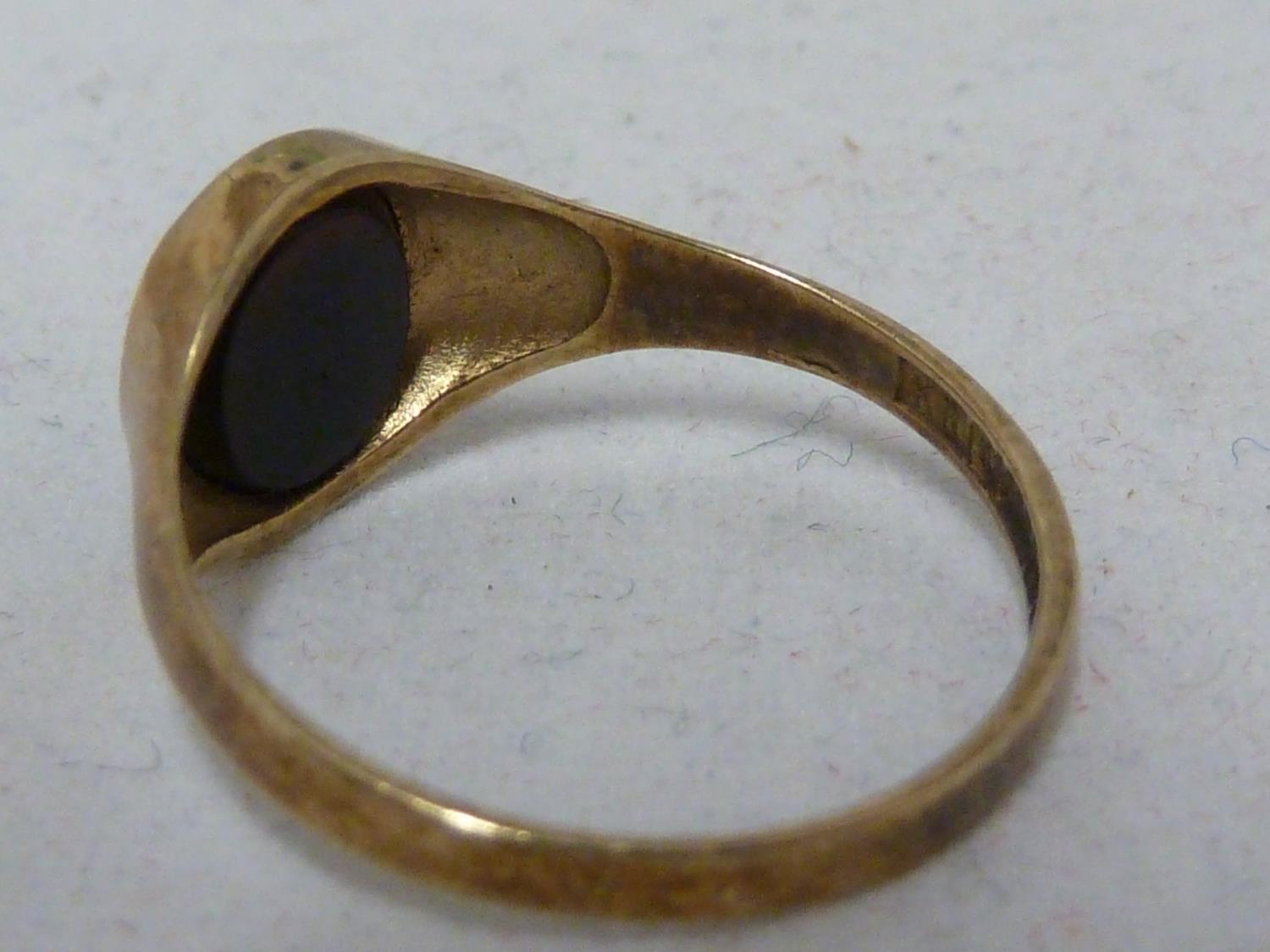 Two yellow gold signet rings, one marked 9ct and set with an oval black stone, ring size L 1/2, - Image 3 of 7