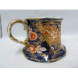 An Early Mason's Patent Ironstone cider mug, decorated in the School House pattern in the Imari