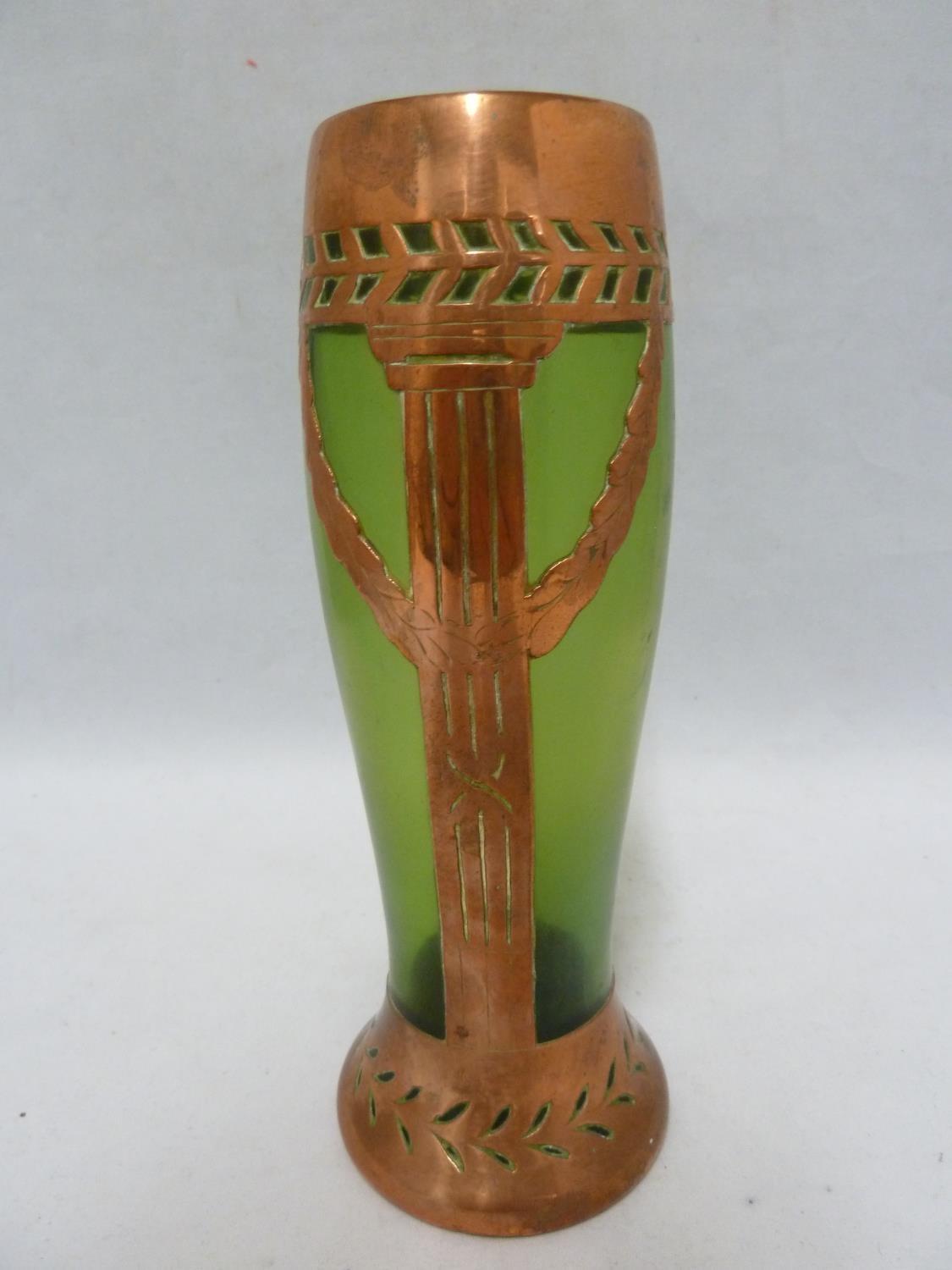 An Austrian Secessionist green iridescent glass vase with copper overlay cut as a column with laurel