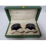 A pair of Art Nouveau style oval table salts, pierced with stylised female heads within sinous