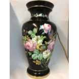 A large French porcelain vase and cover, painted with birds nest, butterfly and Summer flowers on