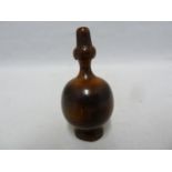 A treen turned wood snuff bottle and cover, probably lignum vitae, of globular body with flared neck