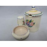 Poole Pottery - a preserve jar and cover; an open salt; and a pepperette, impressed 299 and 286,