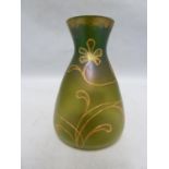 Loetz - An iridescent green glass vase of flask form, tubelined and gilded with a flowering vine,